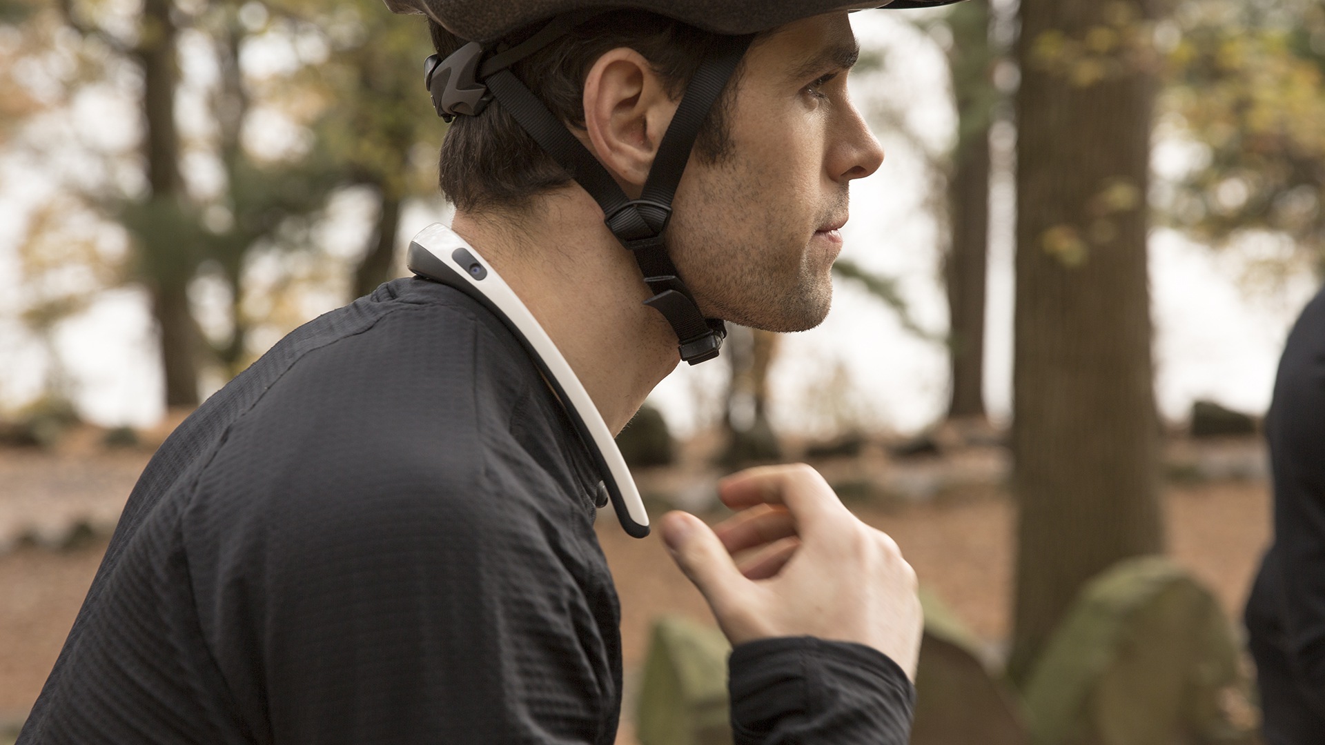 cyclist wearing smart neckband