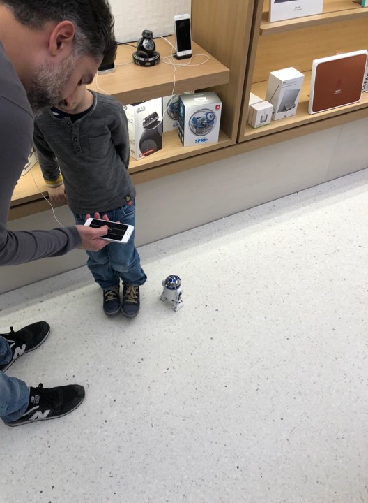 father and son with robot