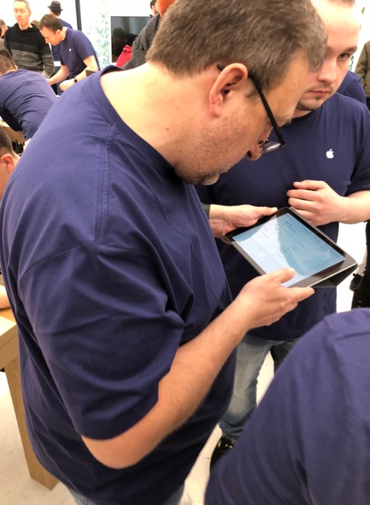 man using tablet in store