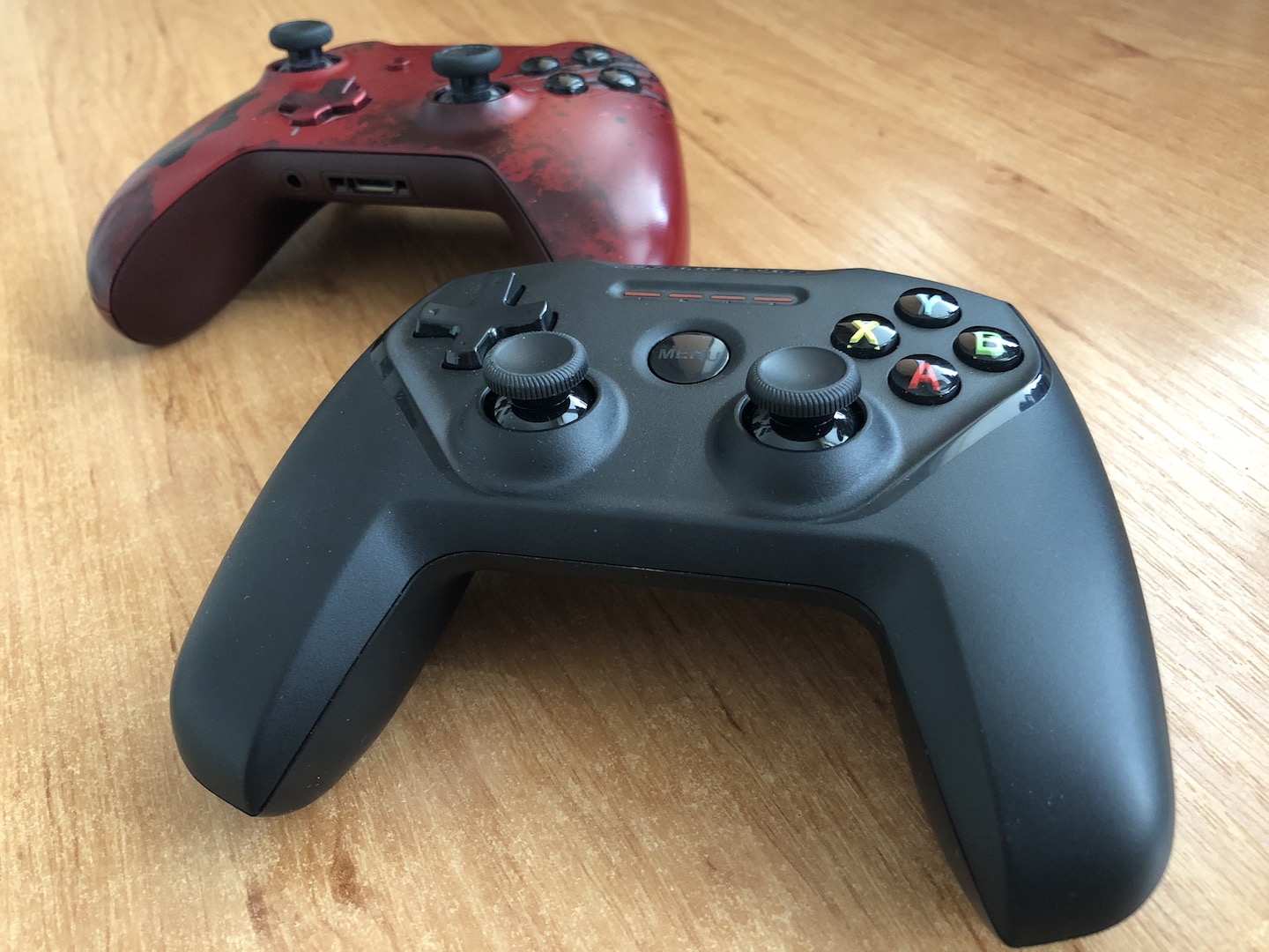 black and red gaming controllers