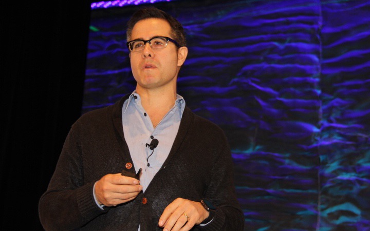 man speaking at conference