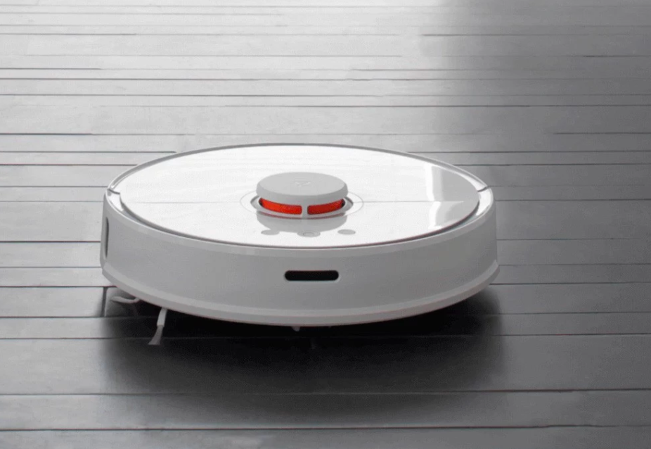 robot vacuum on dark floor
