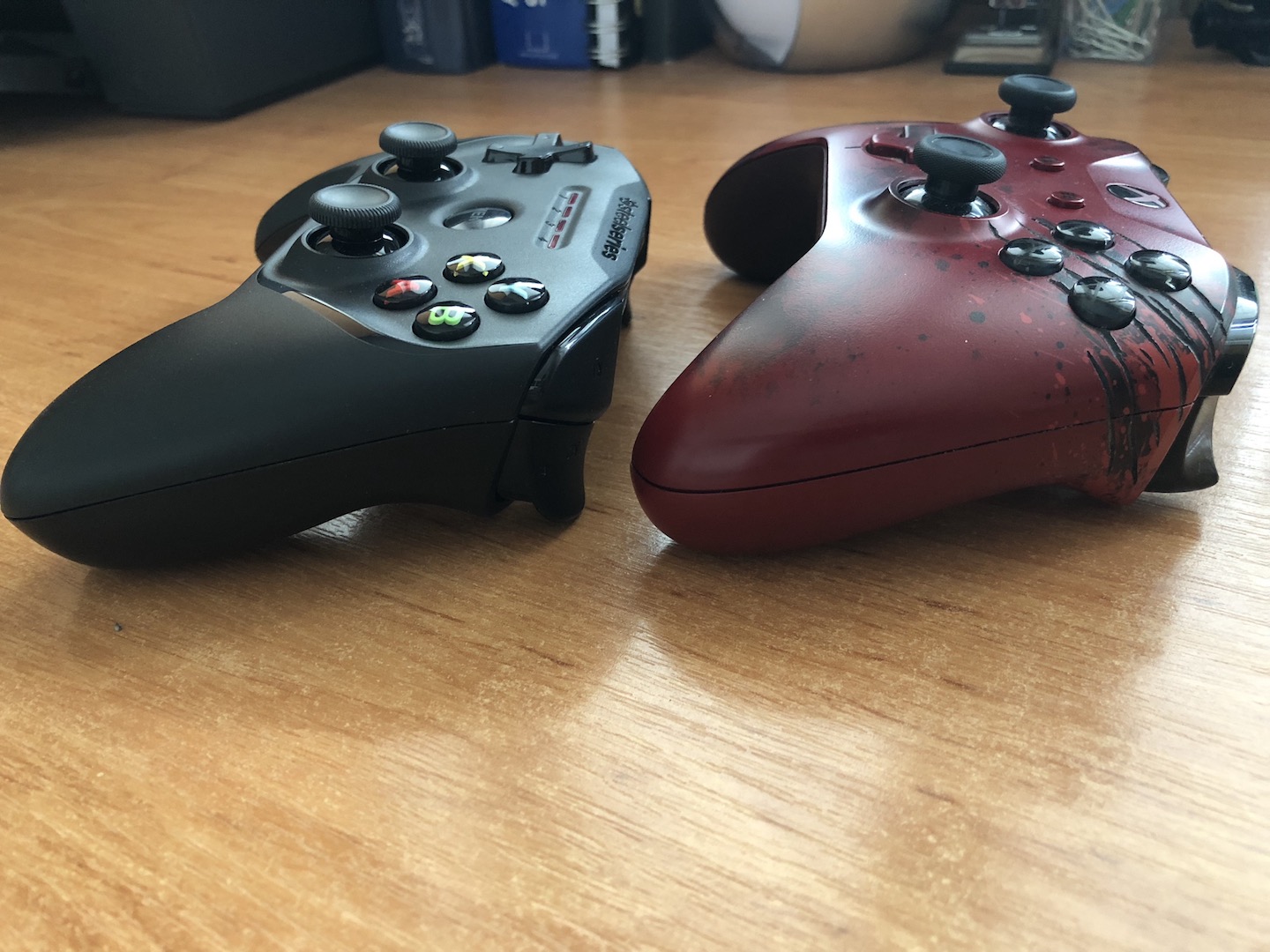 two gaming controllers on table