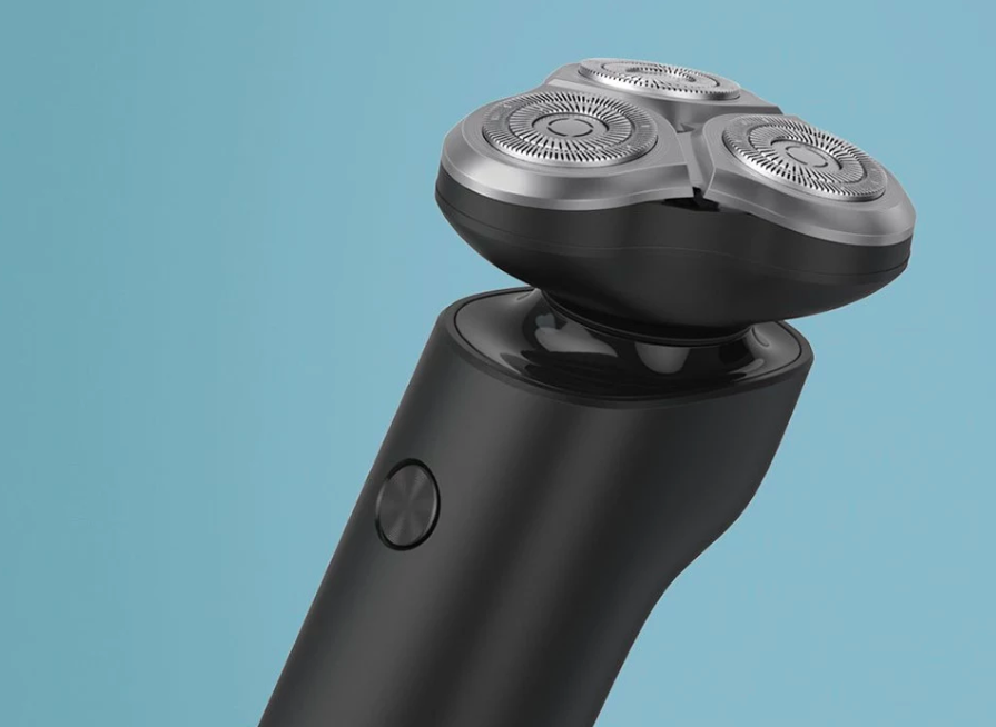 electric shaver close up blue background