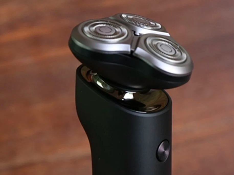 electric shaver close up wooden background