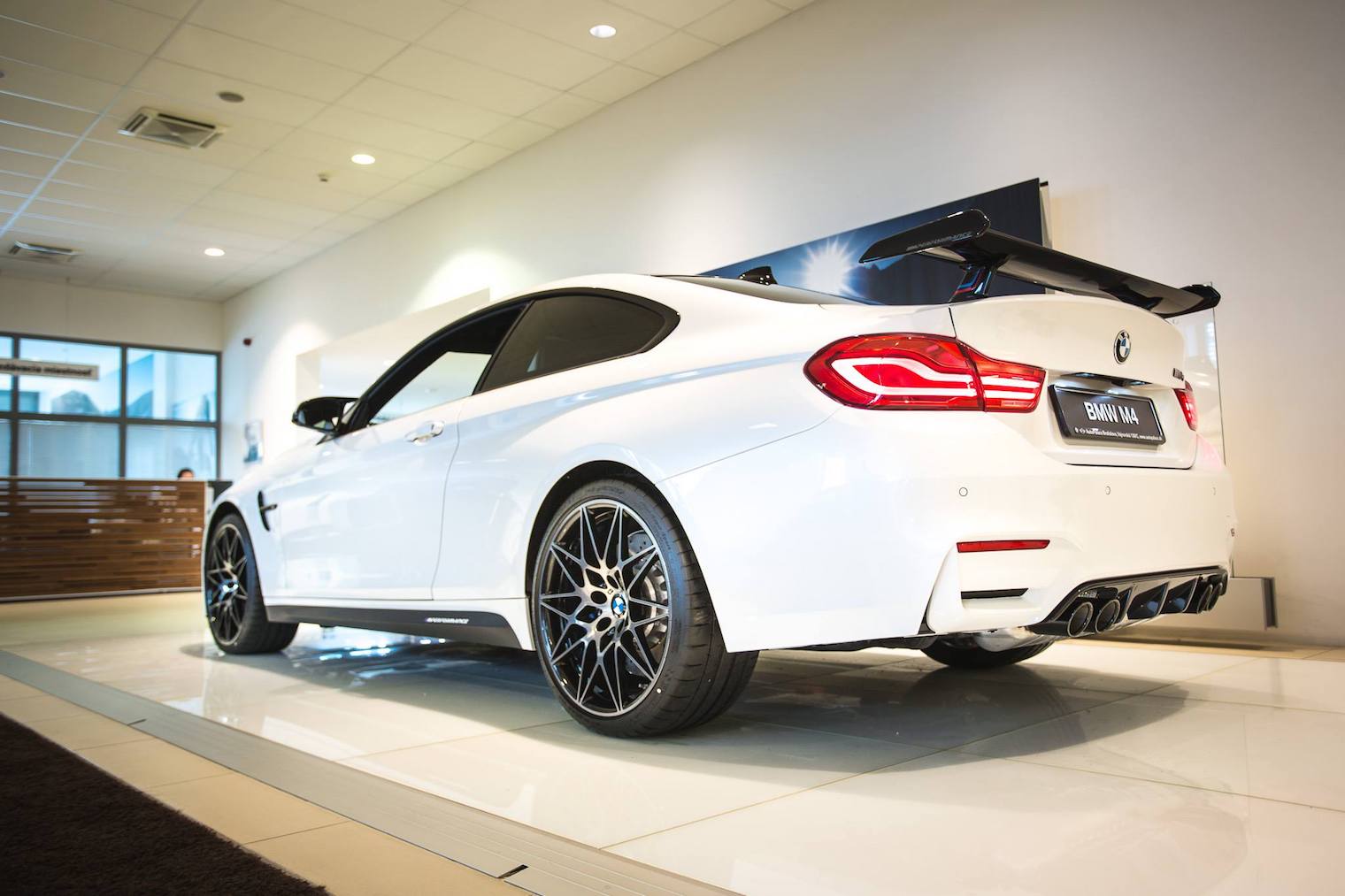 white bmw m4 rear side