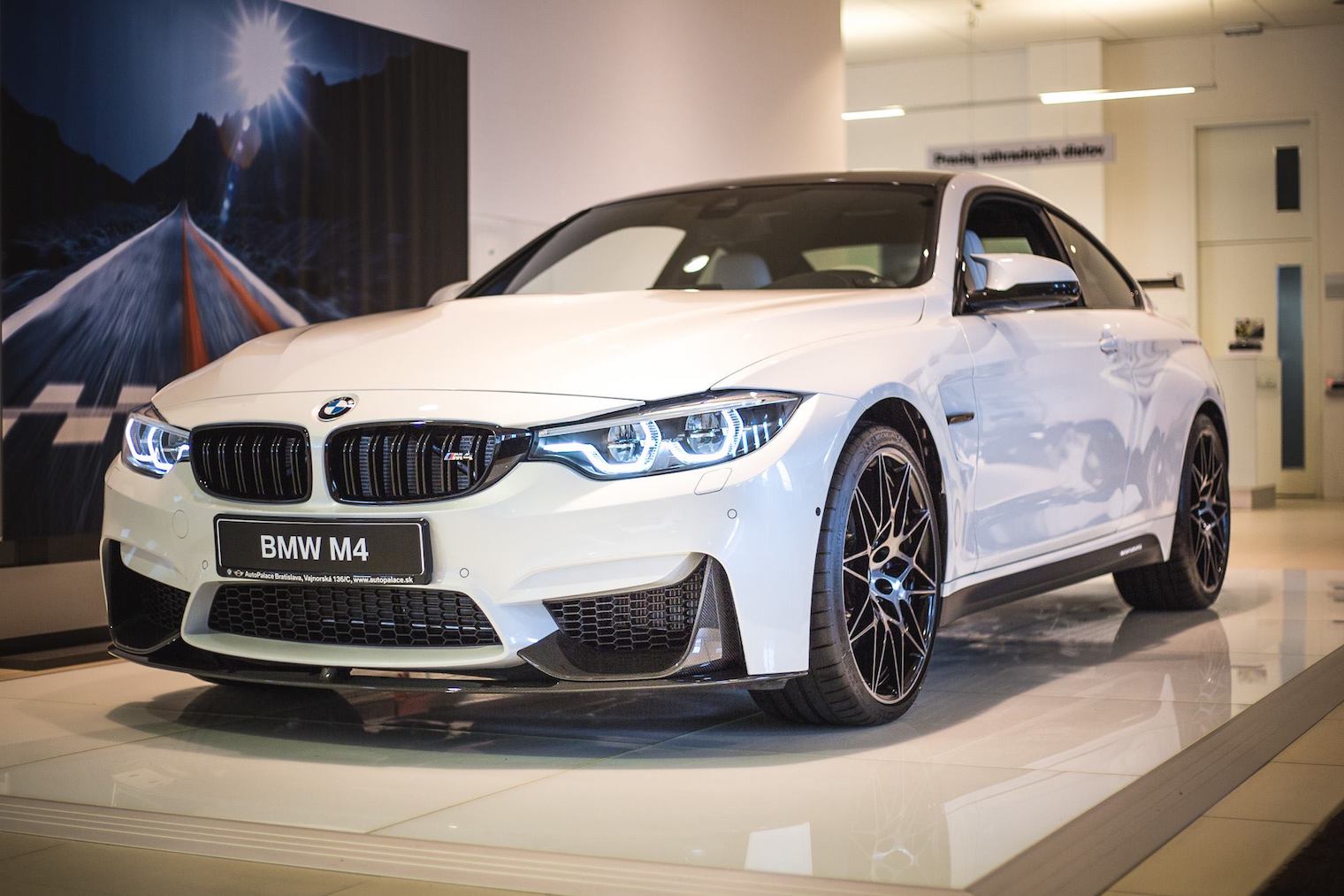 white bmw m4 side view