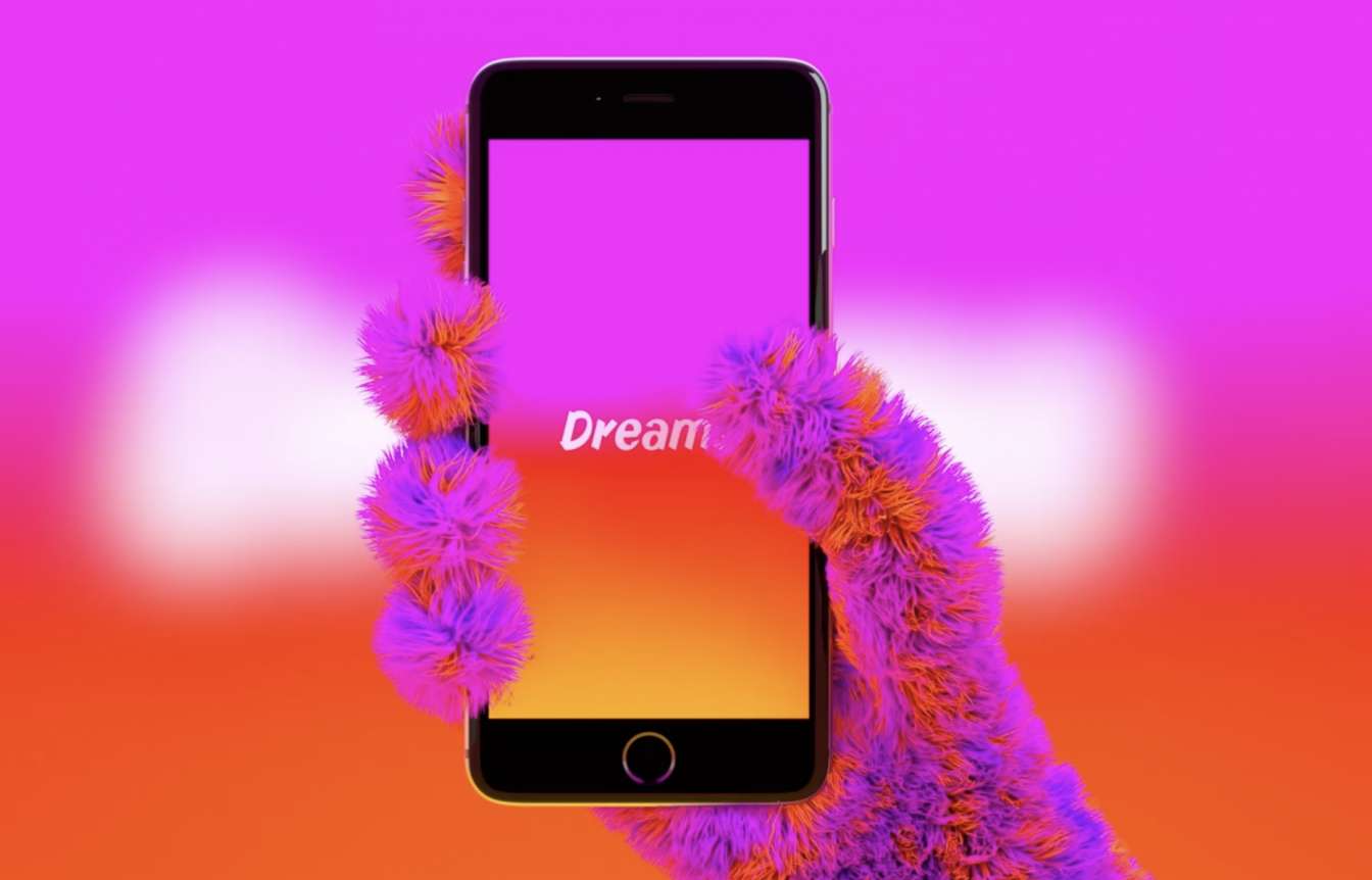 furry hand holding smartphone