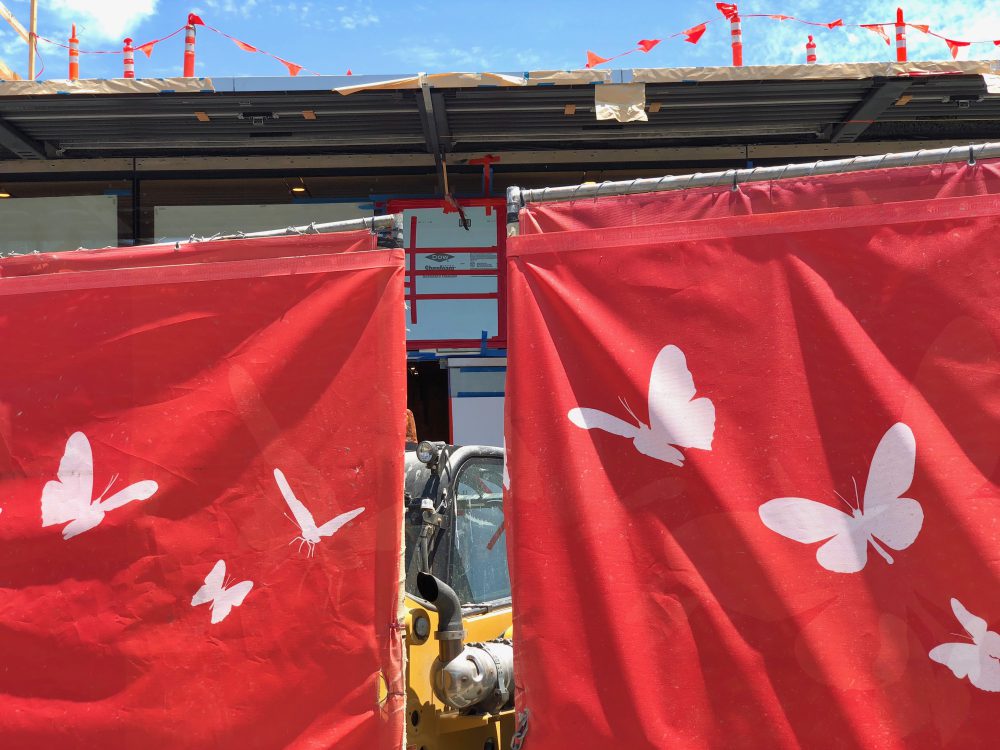 red fence butterfly design