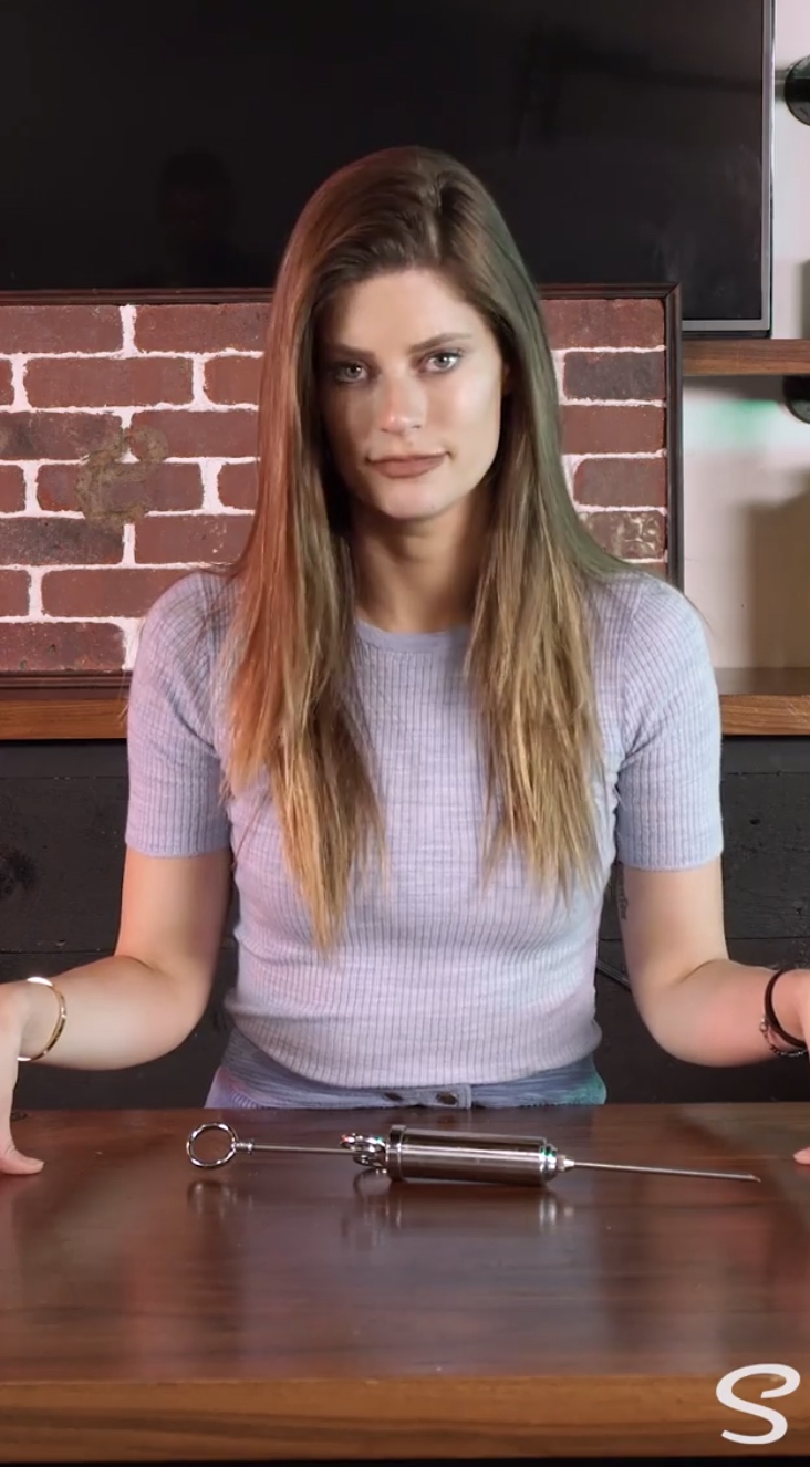 woman with device on table