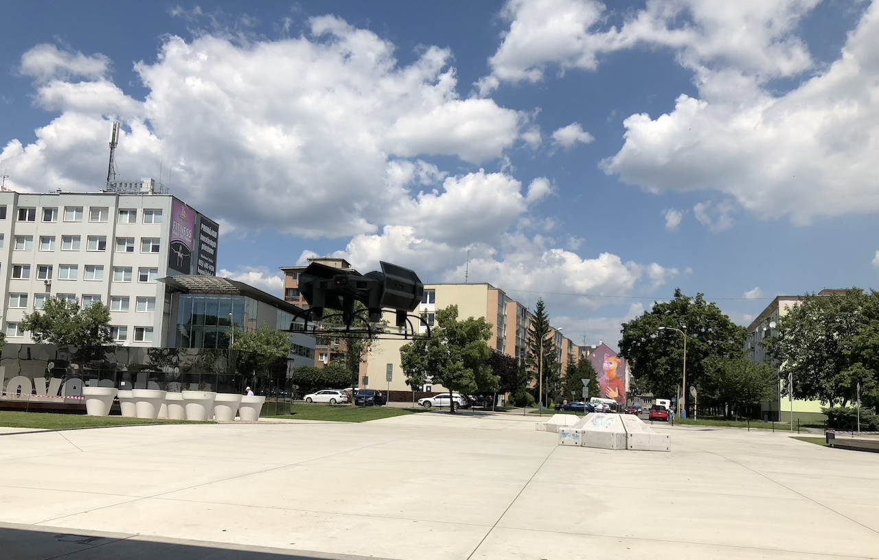 drone flying over urban area