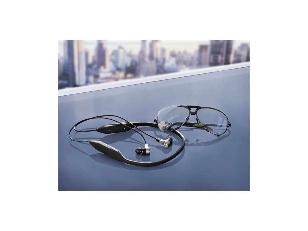 glasses and earphones on table