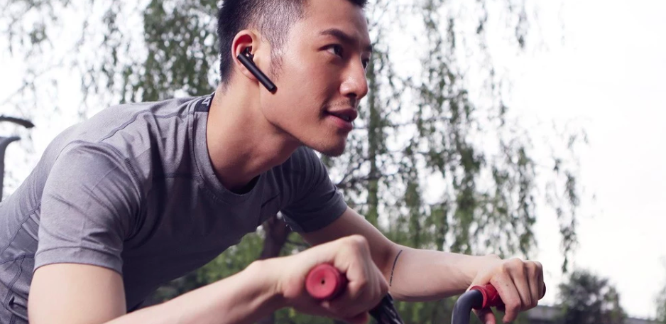man wearing bluetooth earpiece