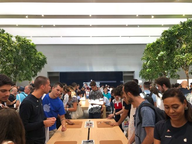 people gathered in tech store
