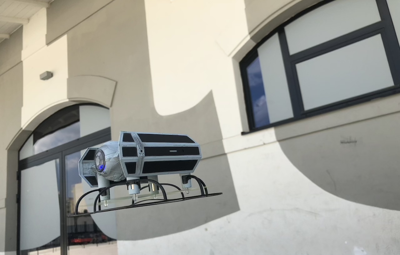 tie fighter drone hovering near building