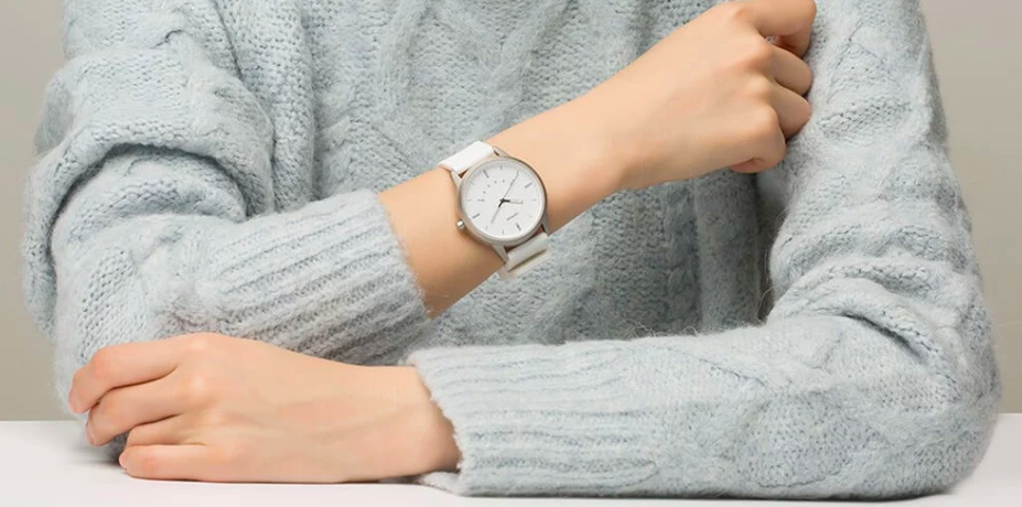 white smartwatch on sweater