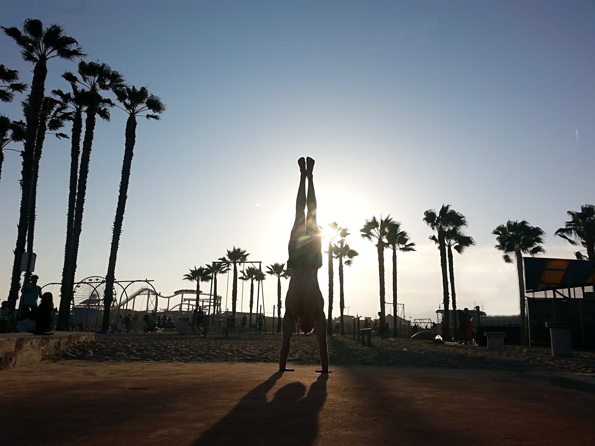 beach handstand sunset