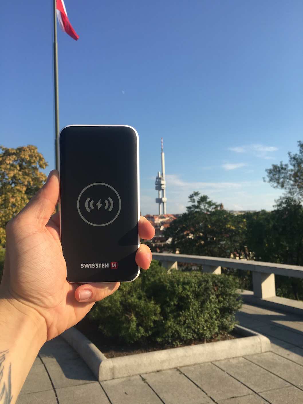 hand holding wireless power bank with tower
