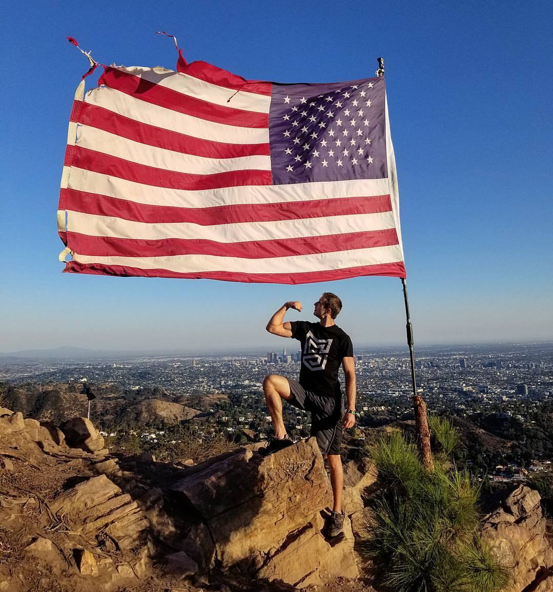 man posing american flag