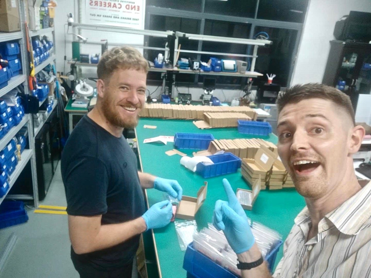 men in electronics workshop