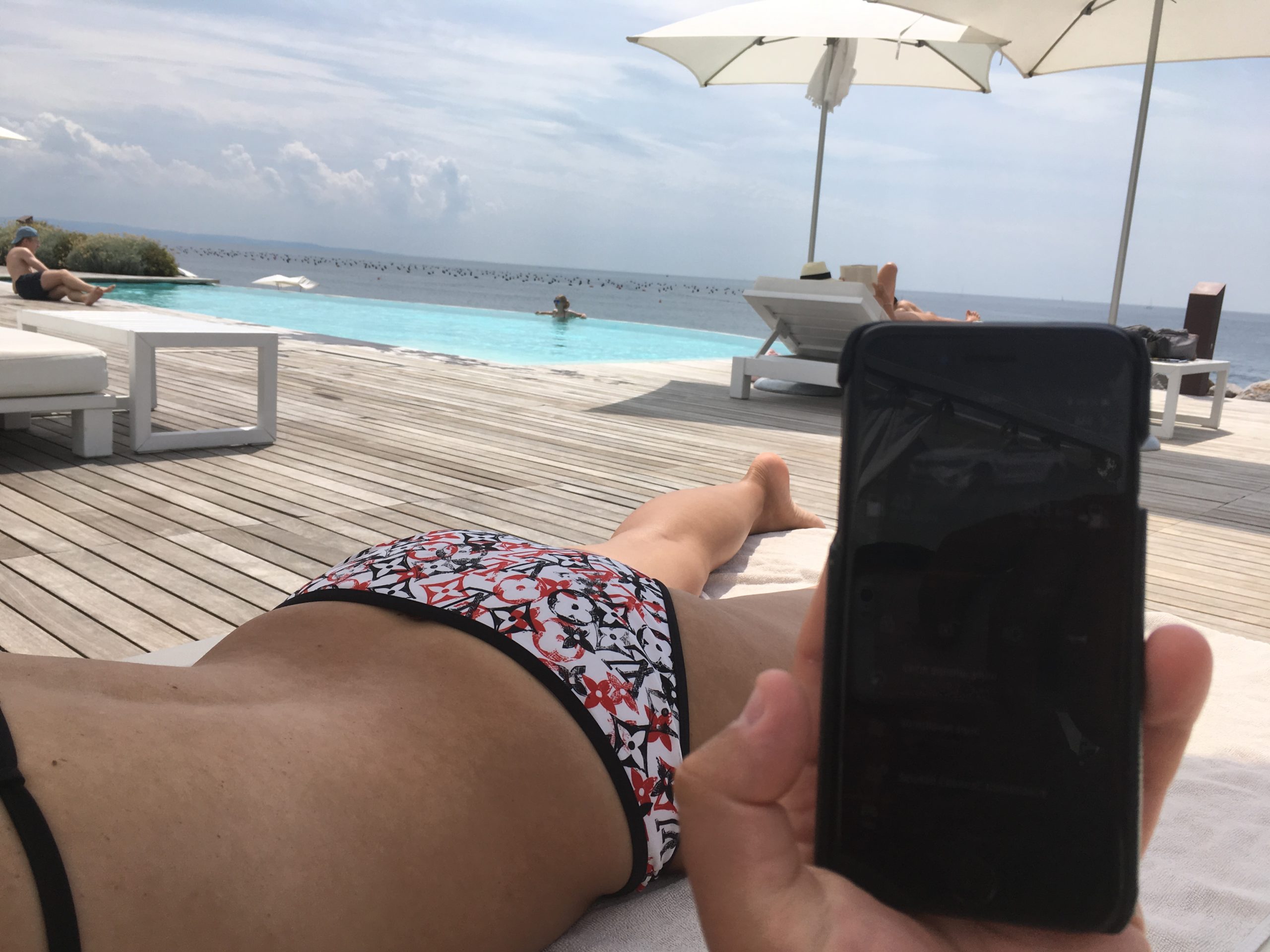 poolside relaxation with phone
