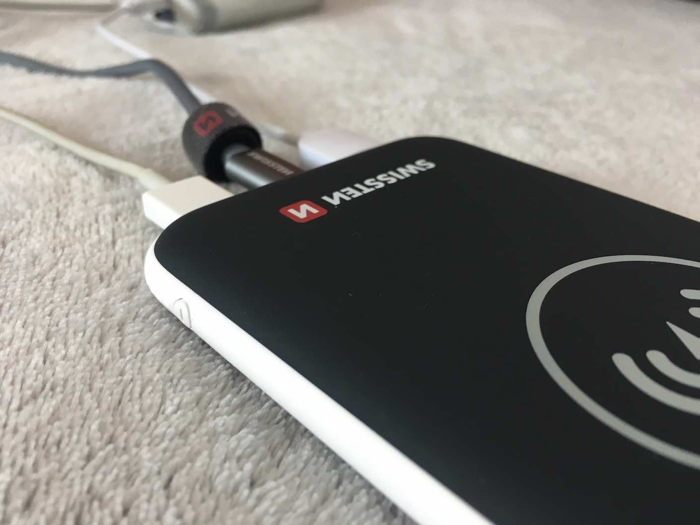 wireless power bank connected to cables