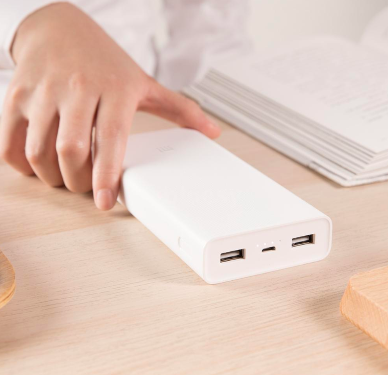 hand holding white power bank