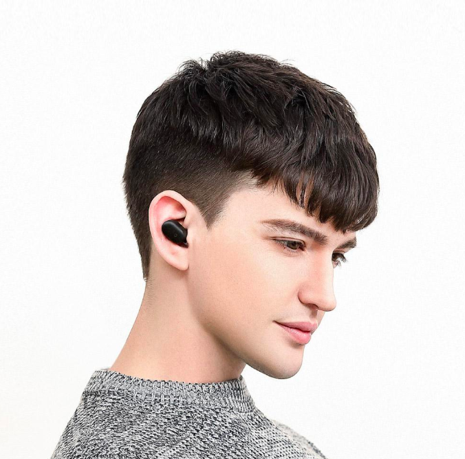 man wearing black earbud