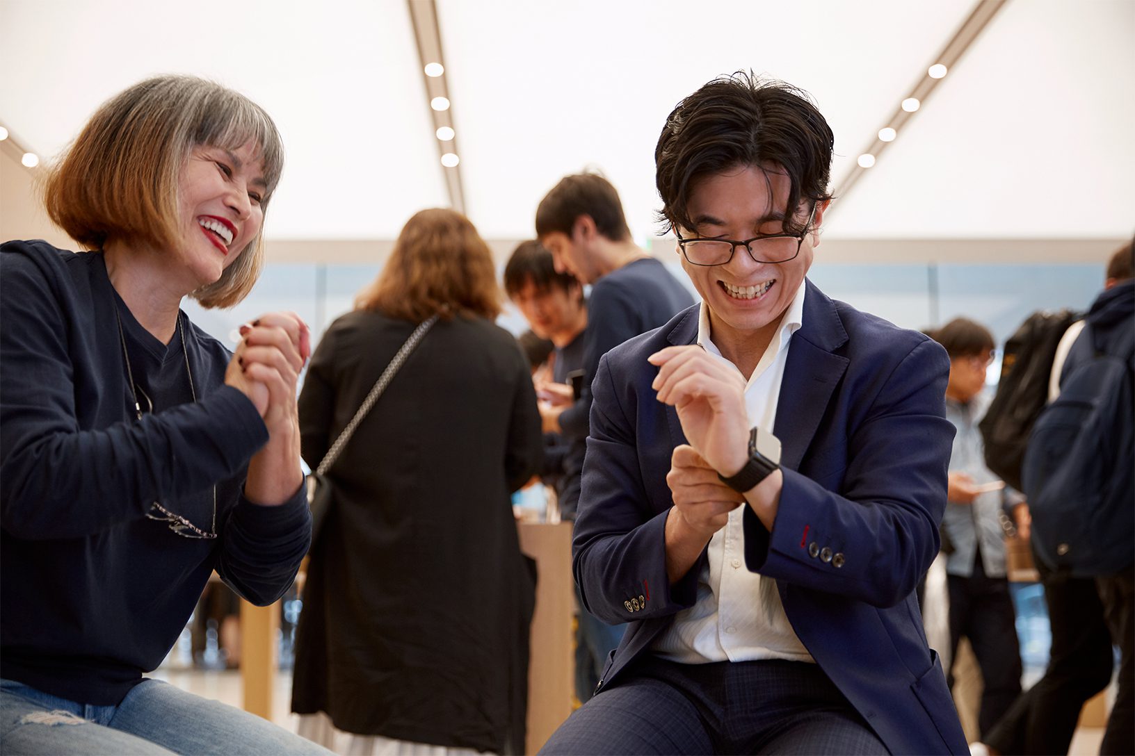 people laughing with smartwatch