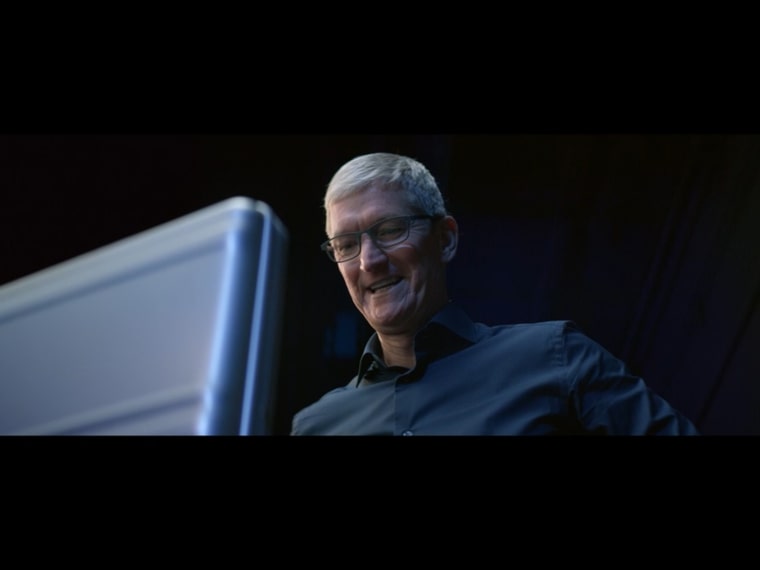 person smiling at computer