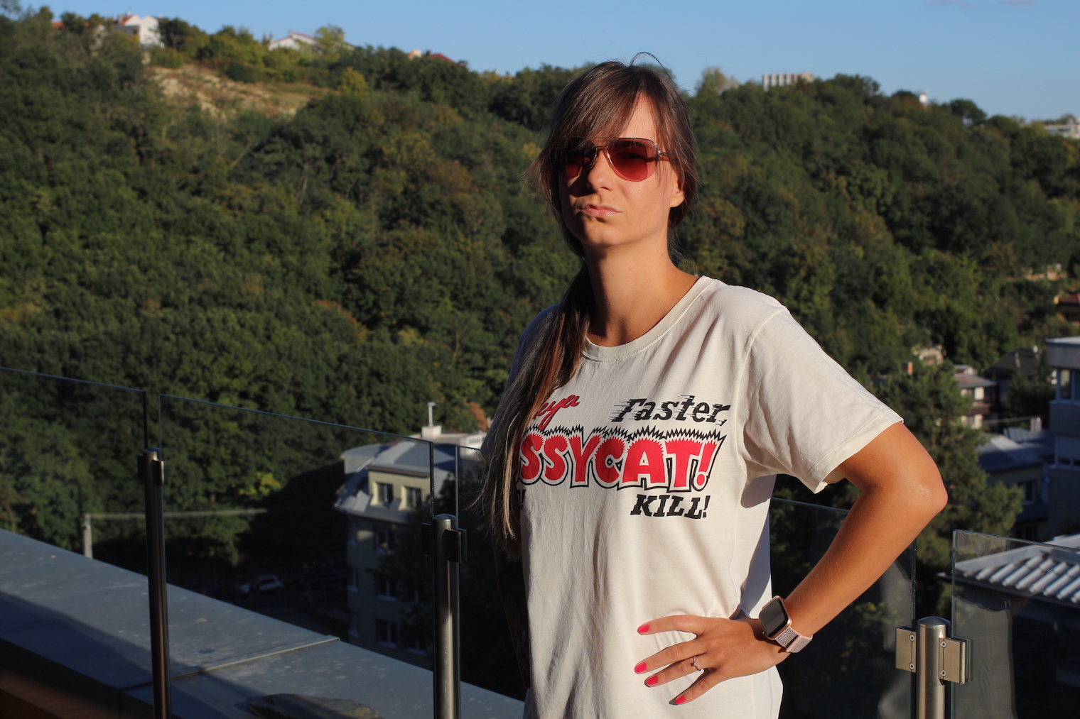 woman posing with smartwatch