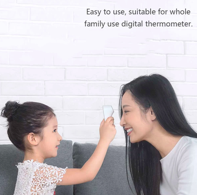 child using digital thermometer