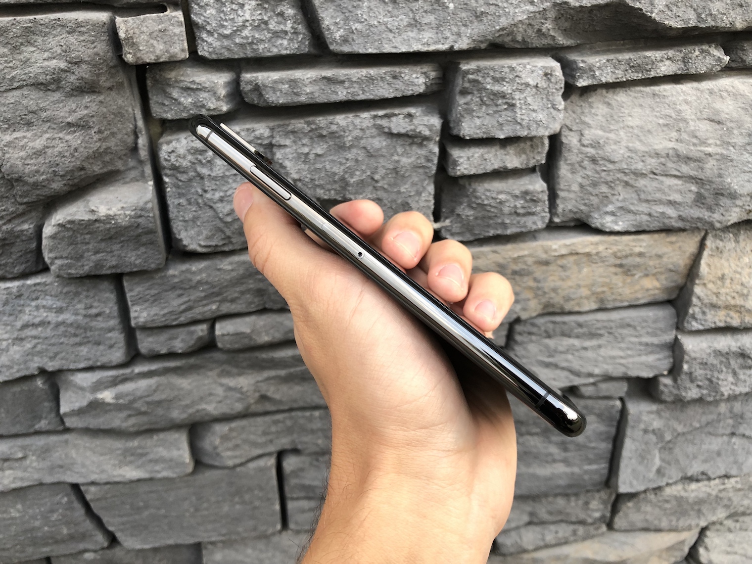 hand holding smartphone side view
