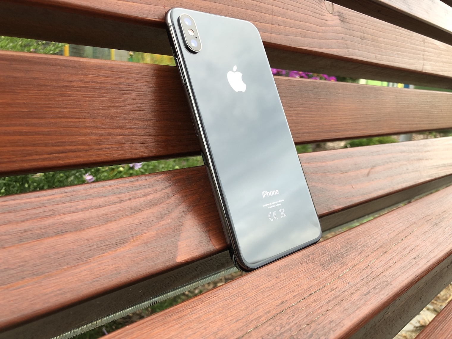 iphone on wooden bench back view