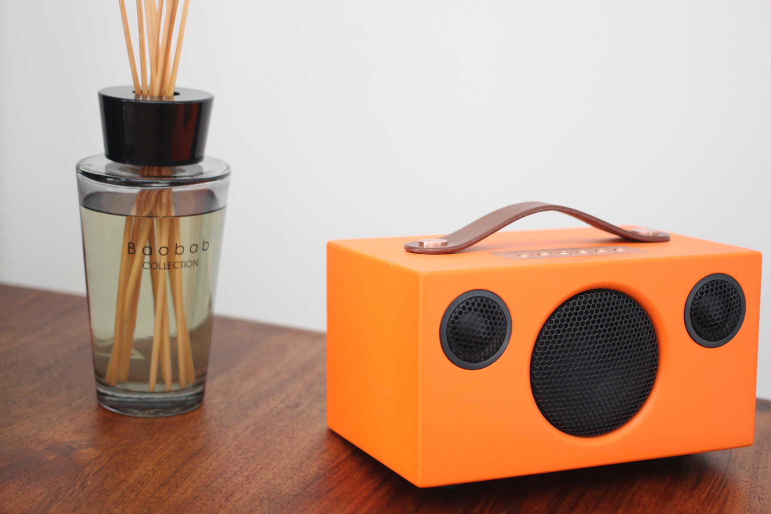 orange speaker on table