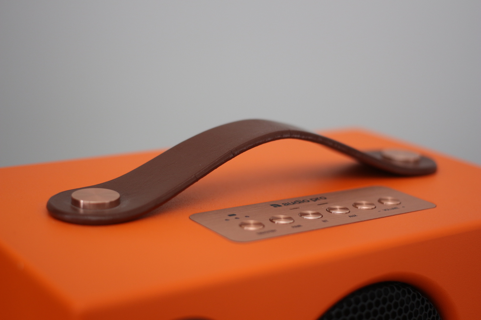 orange speaker with handle
