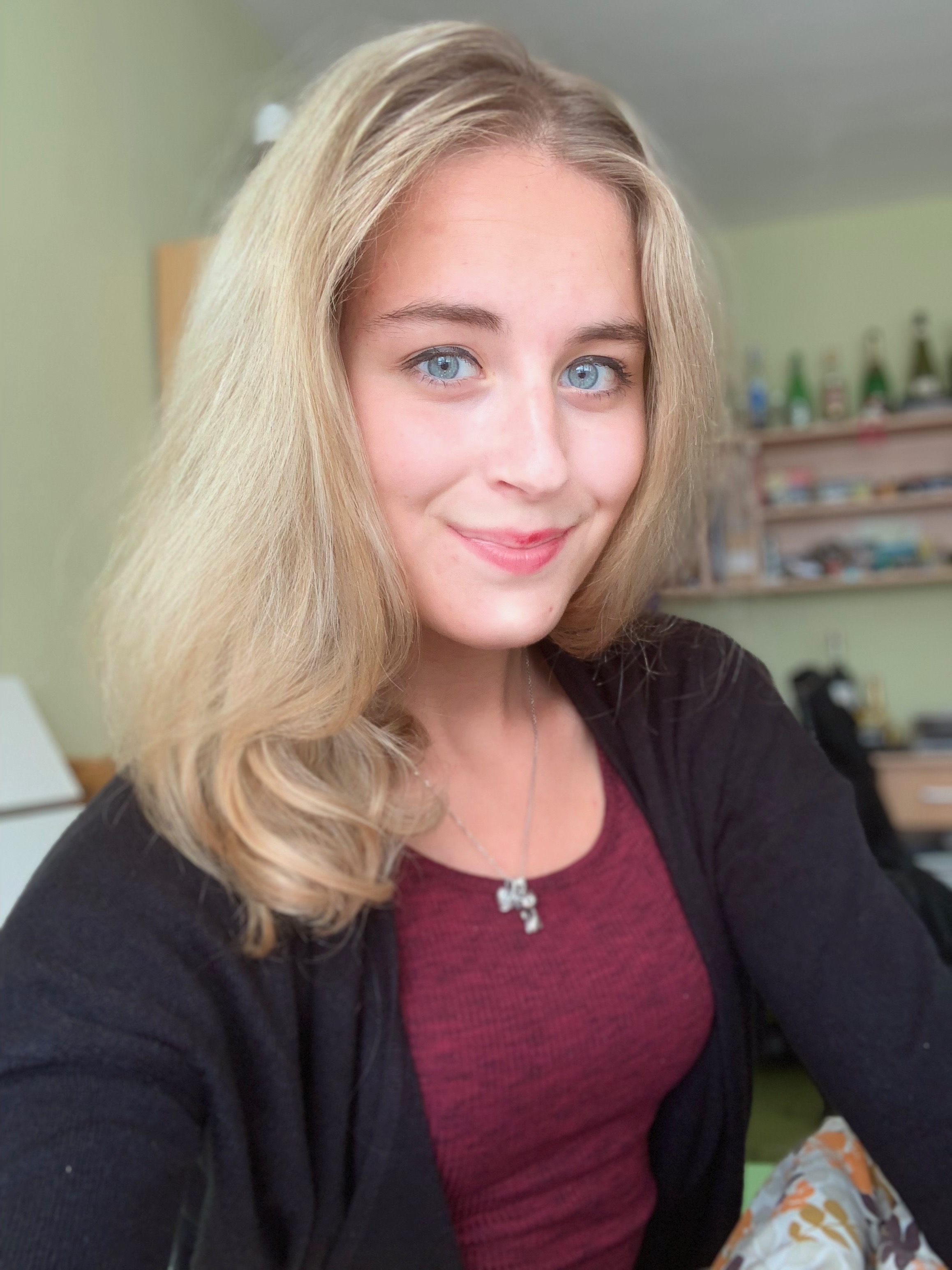 person blonde hair smiling