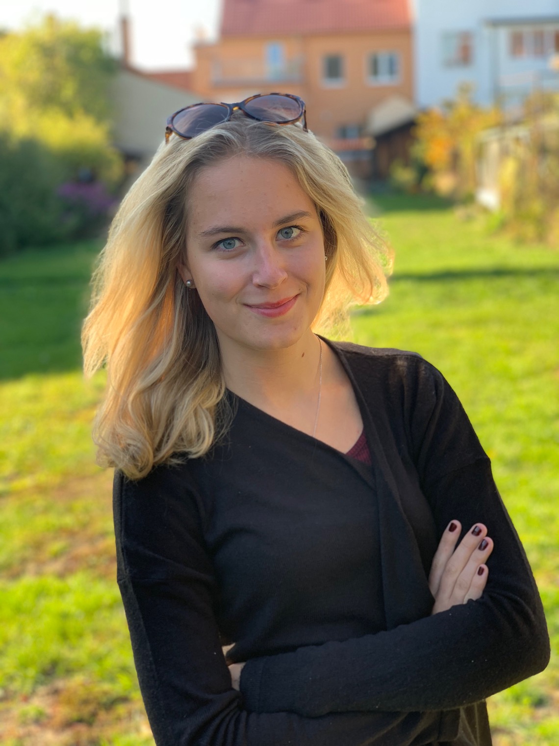 person standing arms crossed