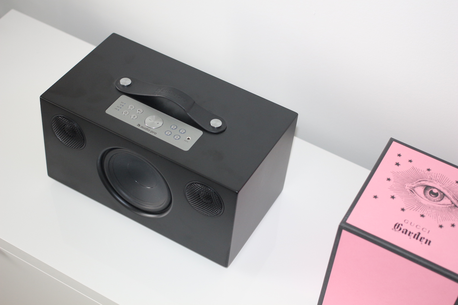 black speaker pink box