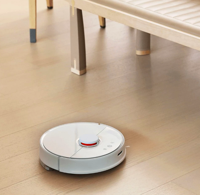 robot vacuum under table