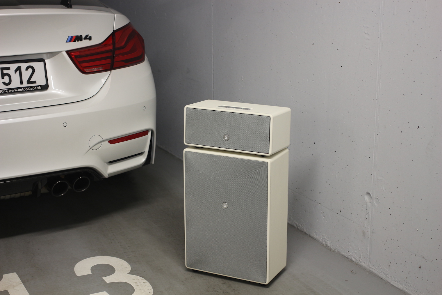 car and speaker in garage 2