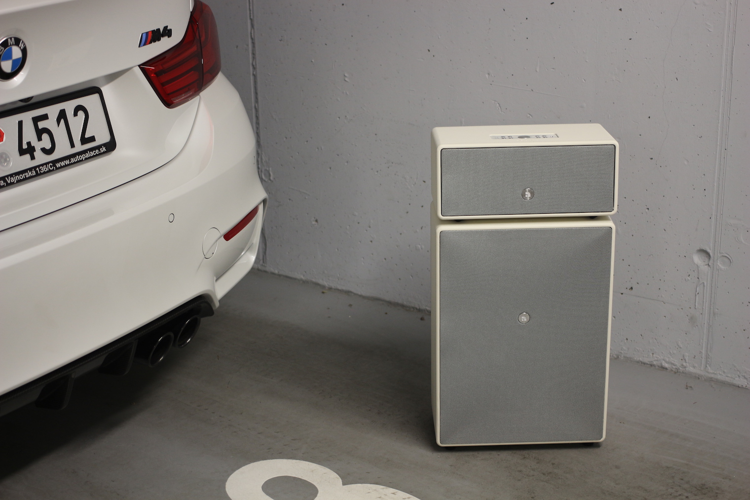 car and speaker in garage 4