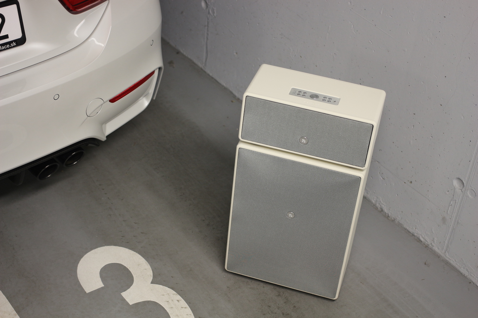 car and speaker in garage