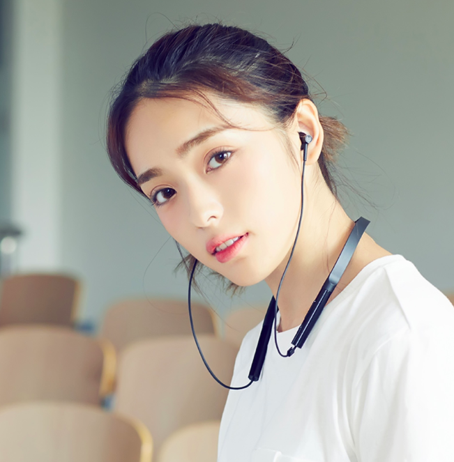 person wearing wireless earphones