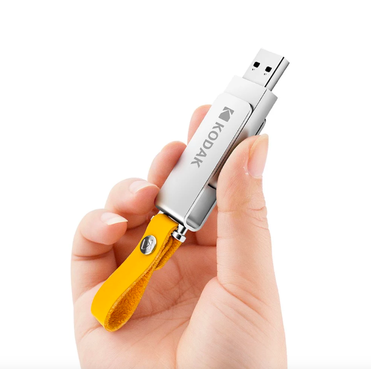 hand holding kodak usb drive closeup