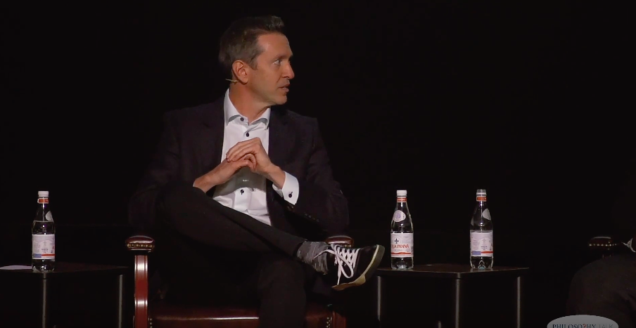 man sitting panel discussion