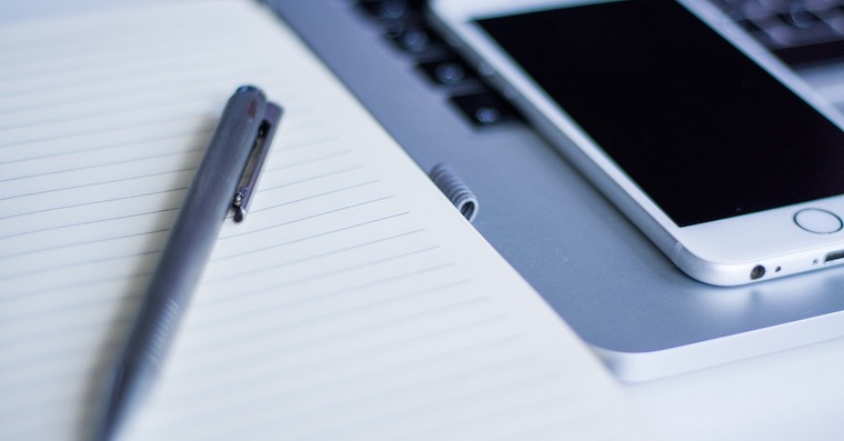 notebook pen and smartphone