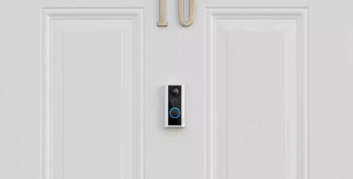 smart doorbell on white door