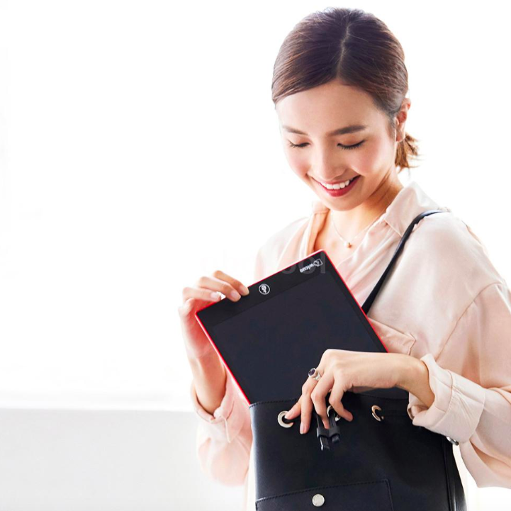 woman holding digital tablet