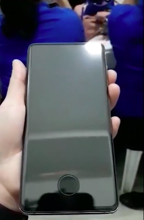 black headphones on metal bench